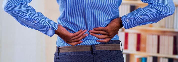 Chiropractic Monterey CA Back Pain Male With Two Hands On Back Chiropractic Monterey CA Back Pain Male With Two Hands On Back